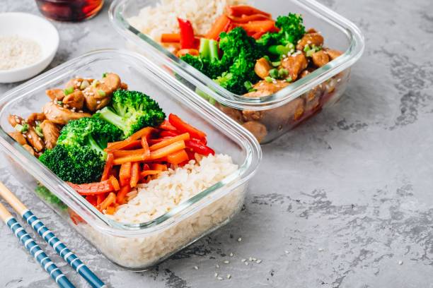 Chicken teriyaki stir fry meal prep lunch box containers with broccoli, rice, and carrots